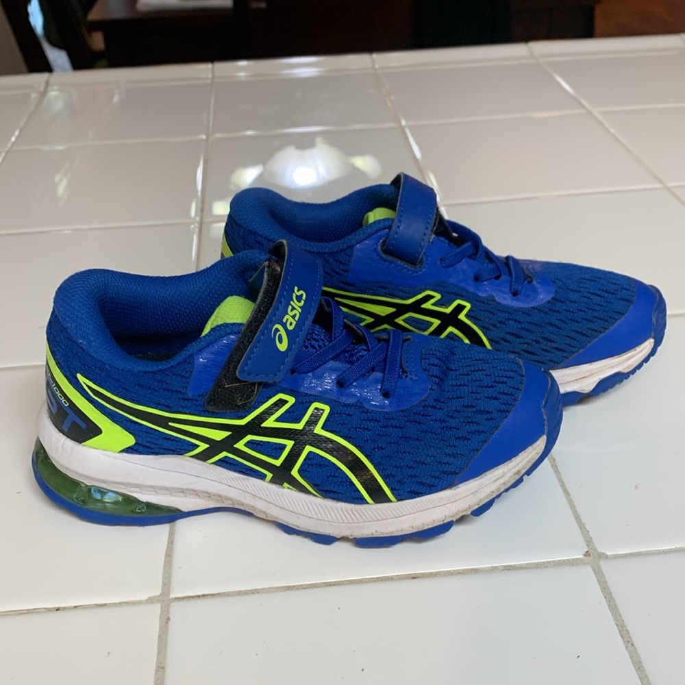 Size 12 little boys Asics. Blue/black/ yellow slip on athletic shoes.